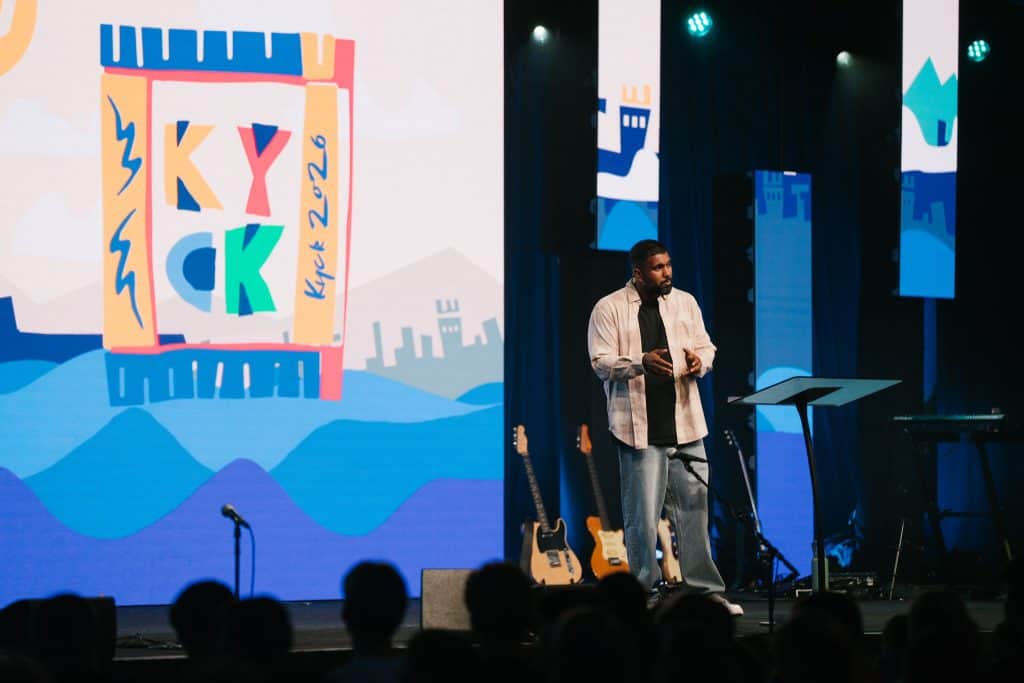 An engaging speaker at KYCK 26, part of the Katoomba Christian Convention, delivering a message to young attendees.