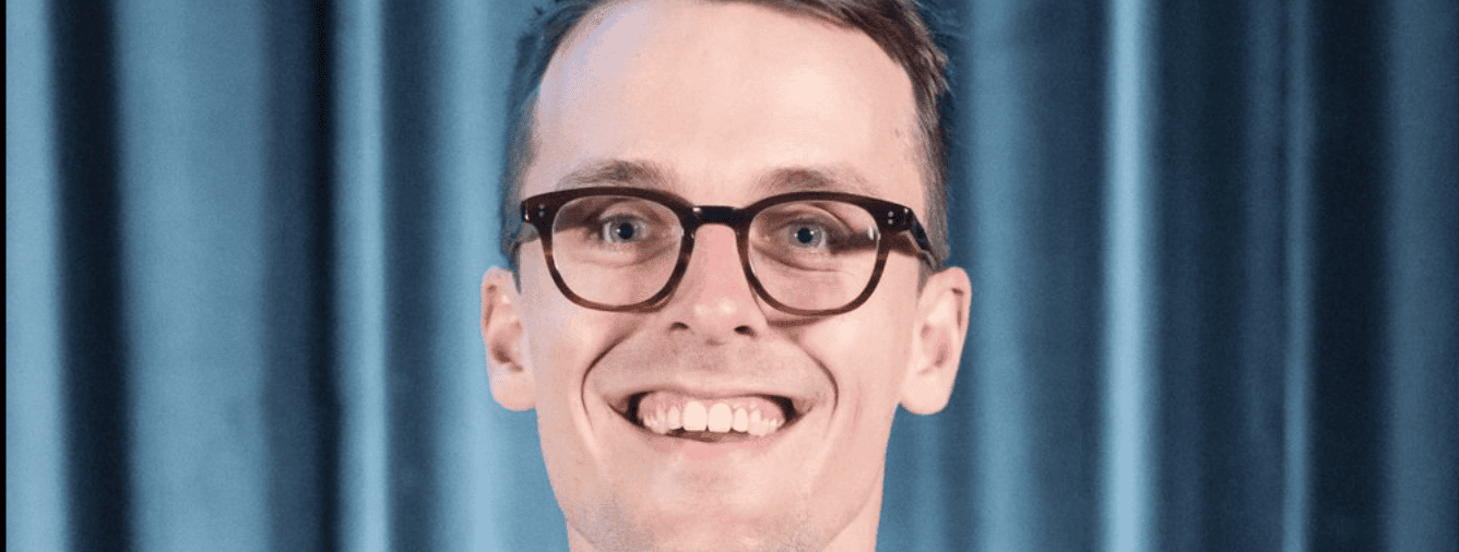 Joshua Hayward, KYCK Committee member, smiling at the Katoomba Christian Convention event.