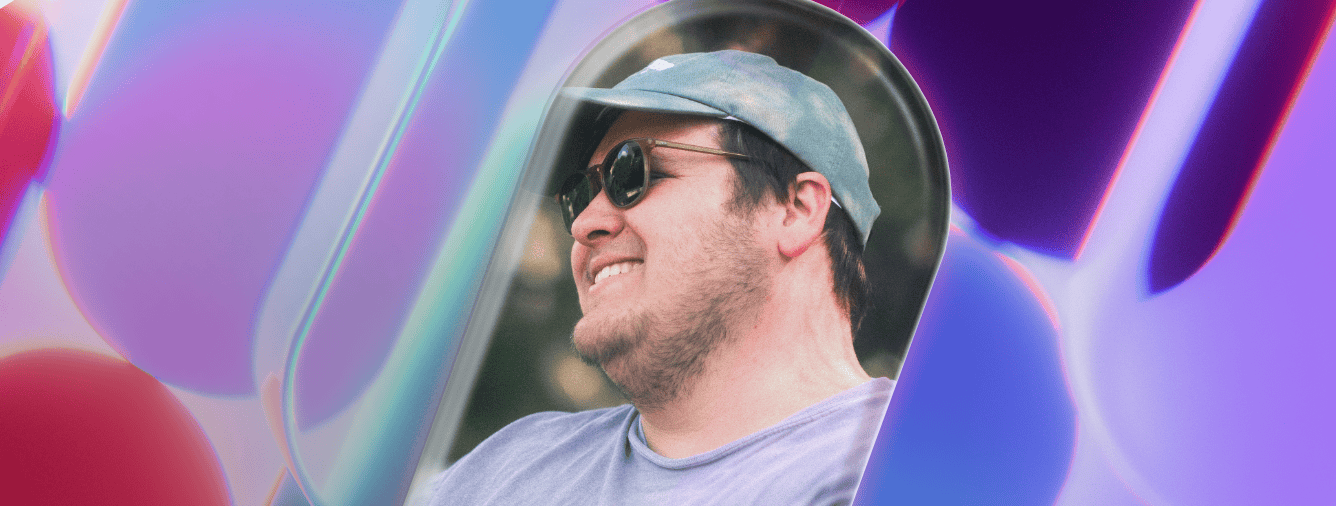 A young man with sunglasses and a cap smiling while looking into a mirror at Katoomba Christian Convention, representing faith and community.