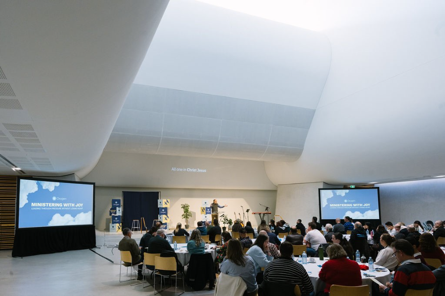 Large conference hall at Katoomba Christian Convention with attendees listening to speakers and engaging in sessions.